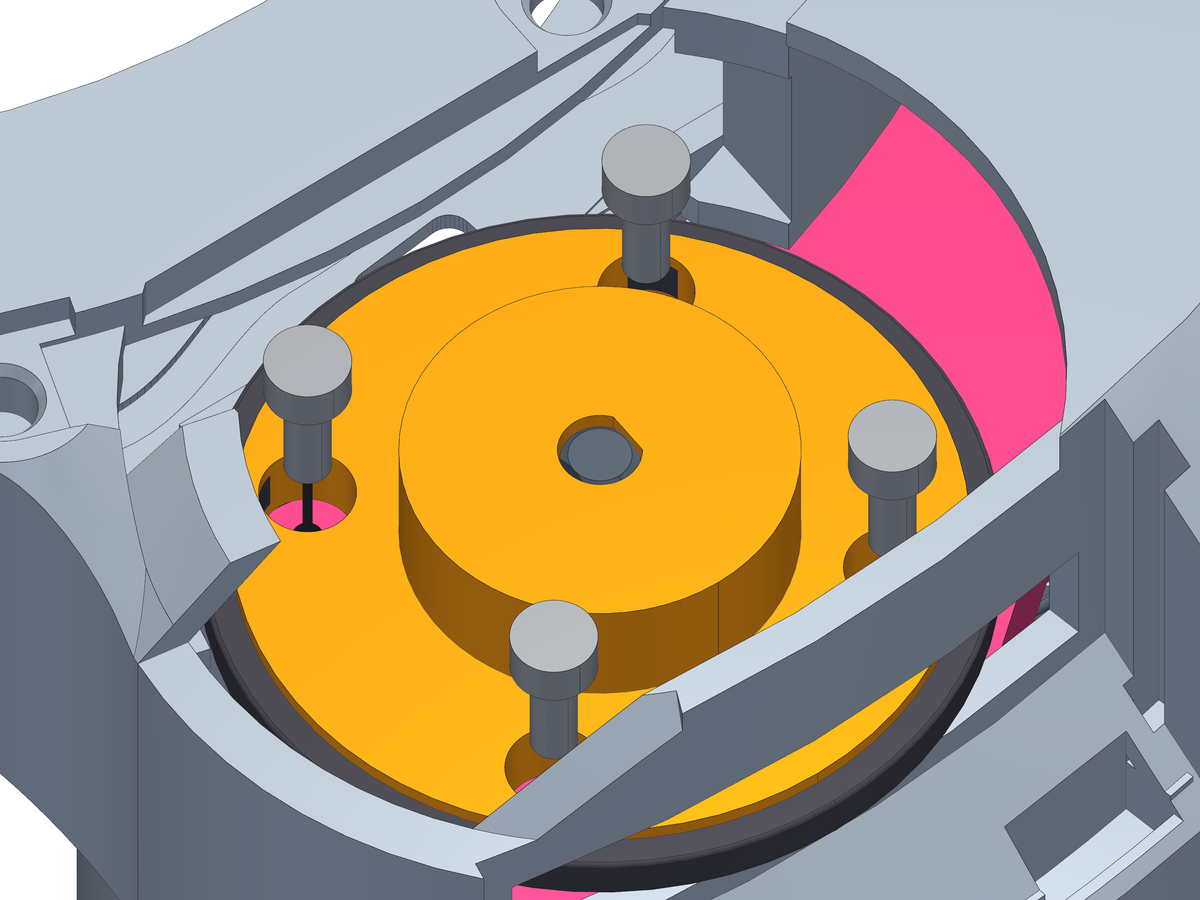 Four screws, from the top, through the clutch